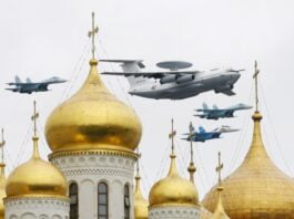 Aircraft fly over Red Square and the Kremlin during a military parade dress rehearsal in Moscow
