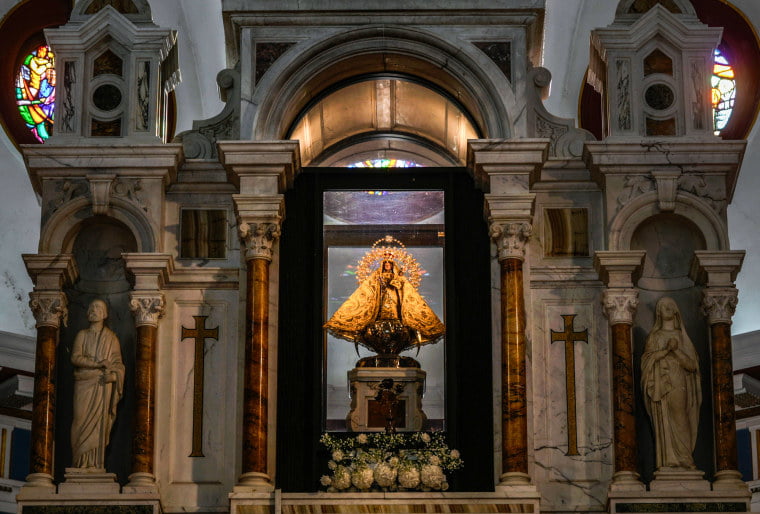 The original statue of the Virgin of Charity of El Cobre stands behind the altar at her shrine