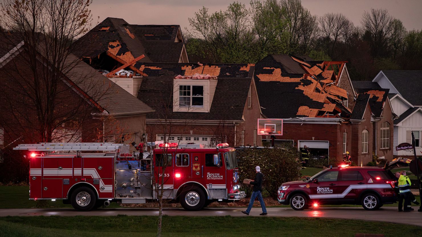 Emergency personnel respond to storm damage in Buckner, Kentucky, after several houses were damaged when severe storms hit the area on Tuesday, April 2, 2024.