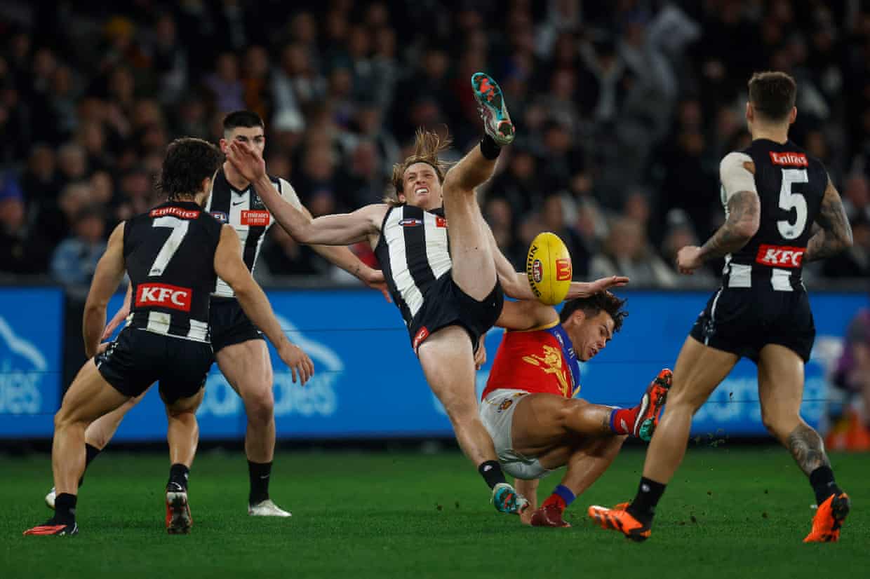 Murphy falls hard after attempting to mark the ball over Cam Rayner in 2023.
