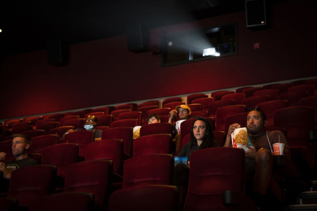 People watch movies in a newly reopened AMC River East theater on Aug. 20, 2020, in Chicago.