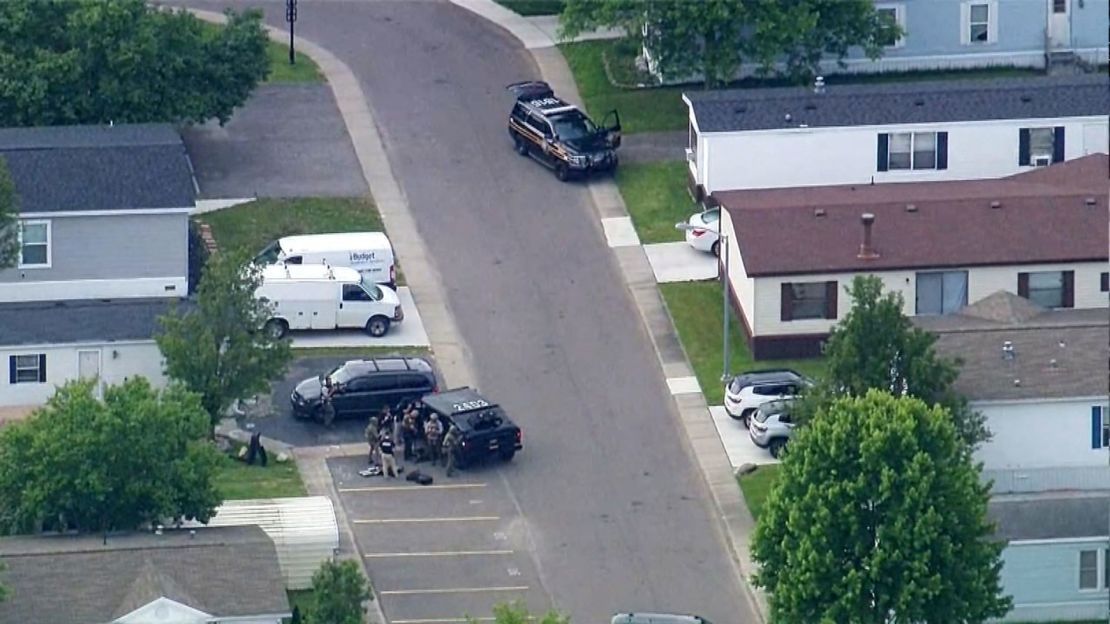 An aerial view of police surrounding a Rochester Hills, Michigan, home where they believe the suspect is contained.
