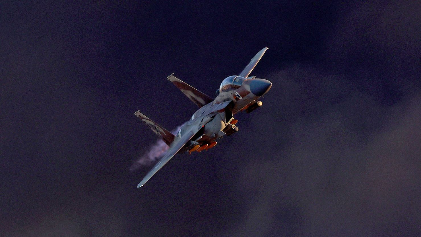 Israel's F-15E Strike Eagle fighter performs maneuvers during the graduation ceremony of Israeli Air Force pilots at the Hatzerim base in the Negev desert on June 29, 2023.