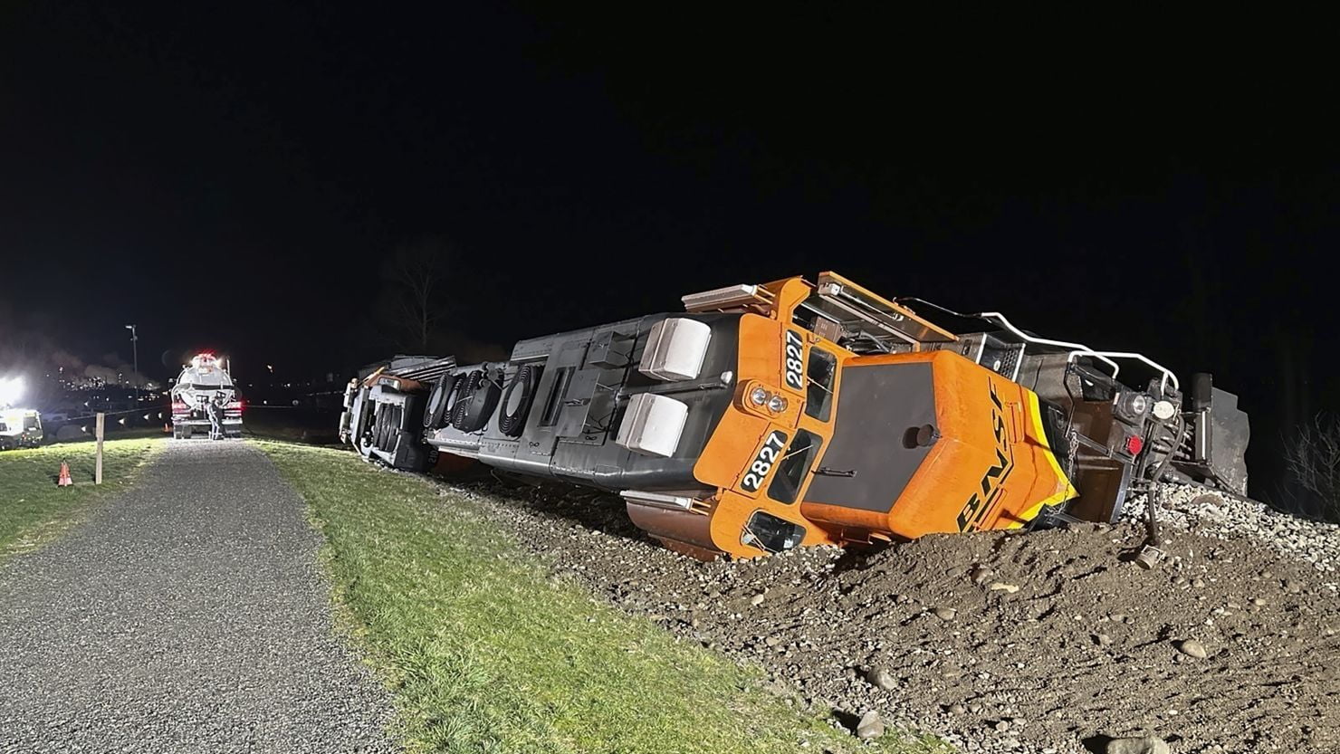 This photo provided by the Washington Department of Ecology shows a derailed BNSF train on the Swinomish tribal reservation near Anacortes, Washington, on March 16, 2023.