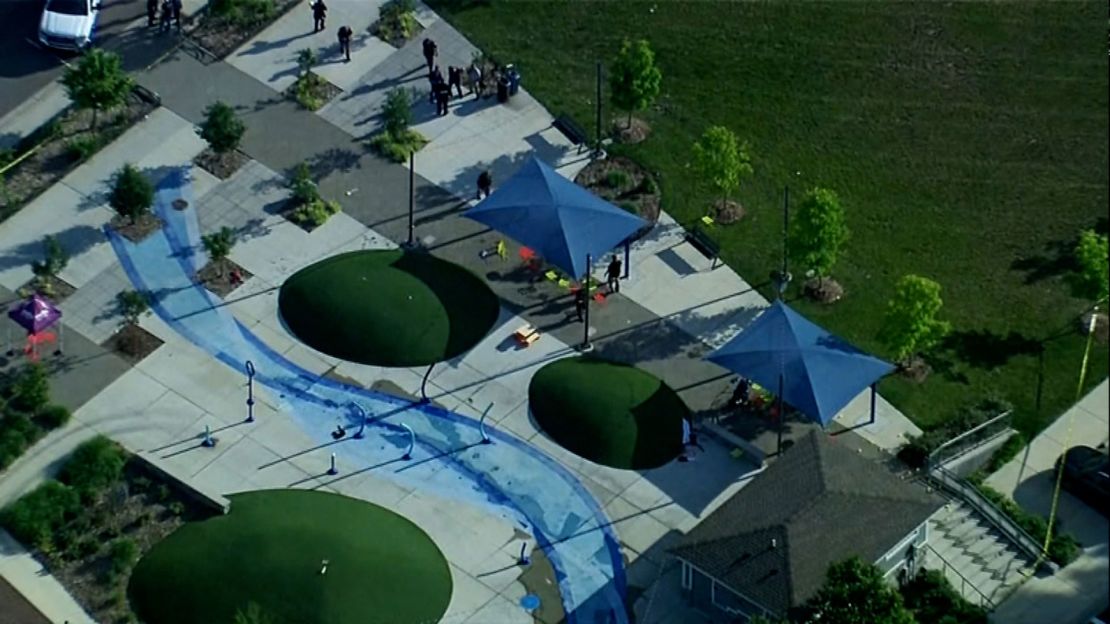 Police respond to the scene of a shooting at the Brooklands Plaza Splash Pad in Rochester Hills, Michigan, on Saturday, June 15, 2024.
