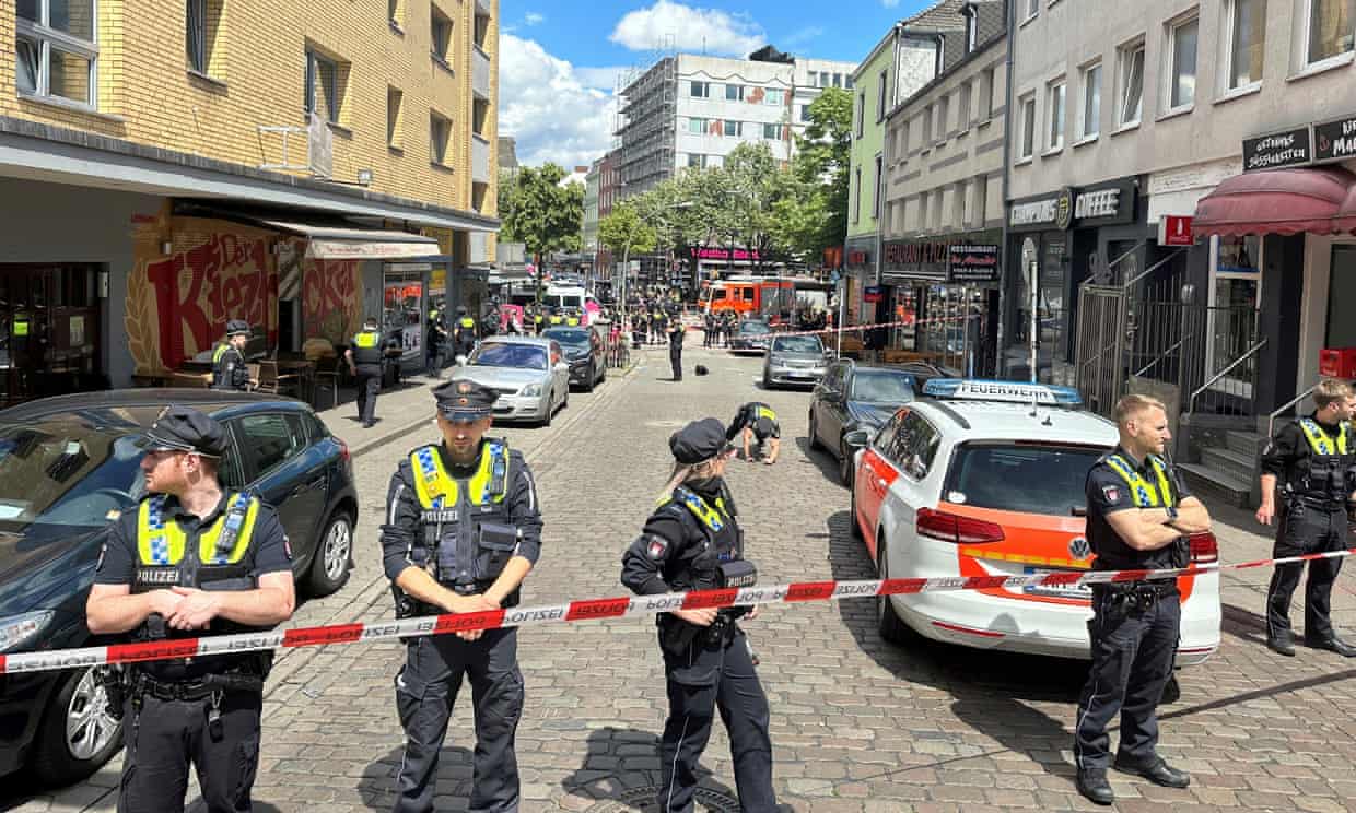 Police cordons off an area near the Reeperbahn in Hamburg, Germany, Sunday, June 16, 2024. It said officers shot and wounded a man who was threatening them with an axe and a firebomb.
