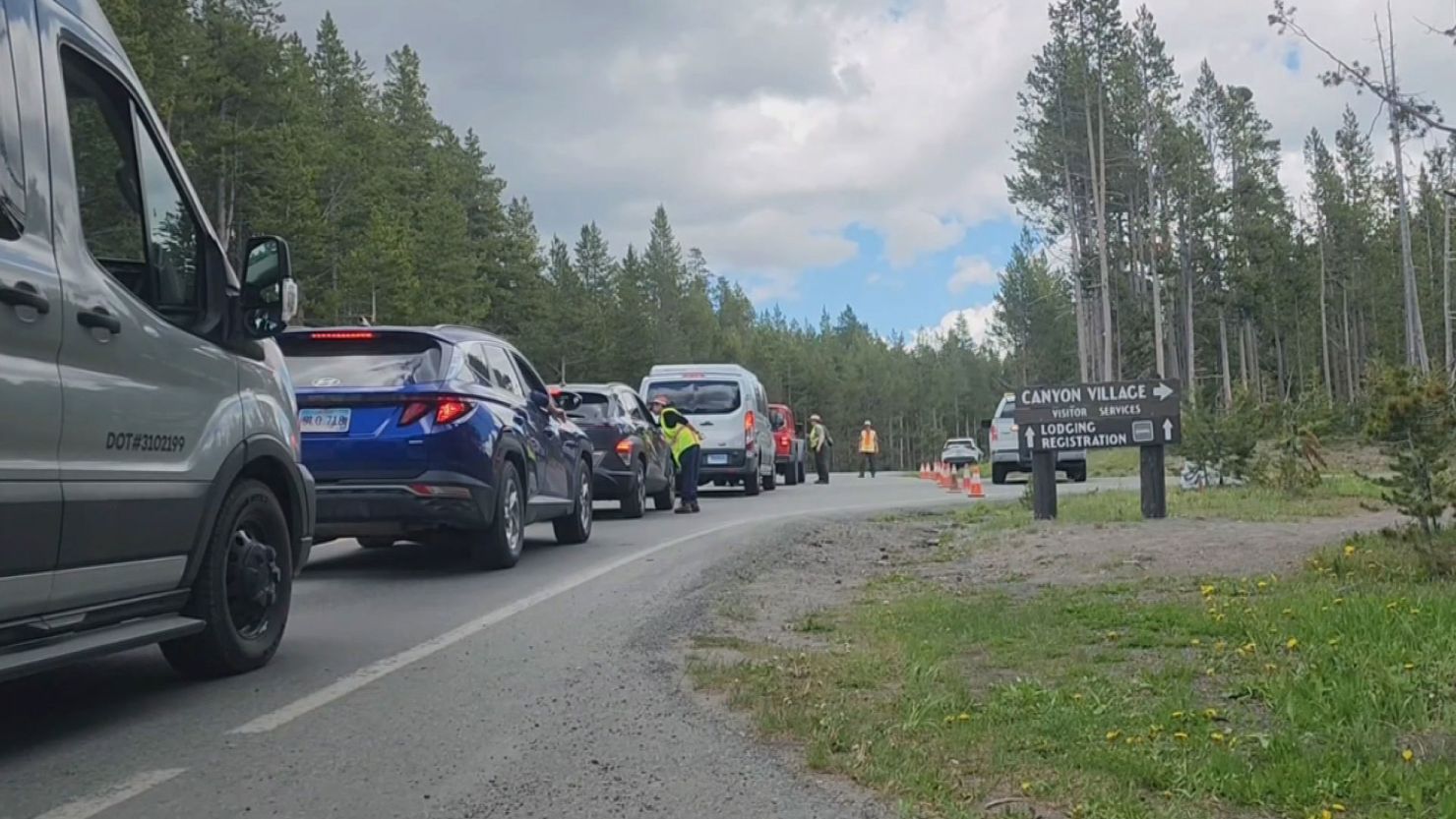 Cars are lined up outside Canyon Village in the central part of Yellowstone National Park on Thursday after a shooting earlier in the day.