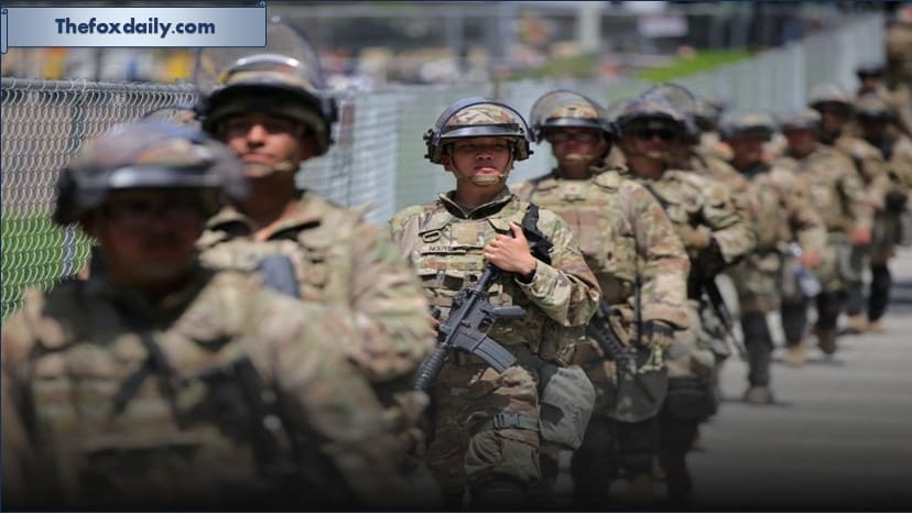 Members of the National Guard walk in formation in Los Angeles on June 14, 2025