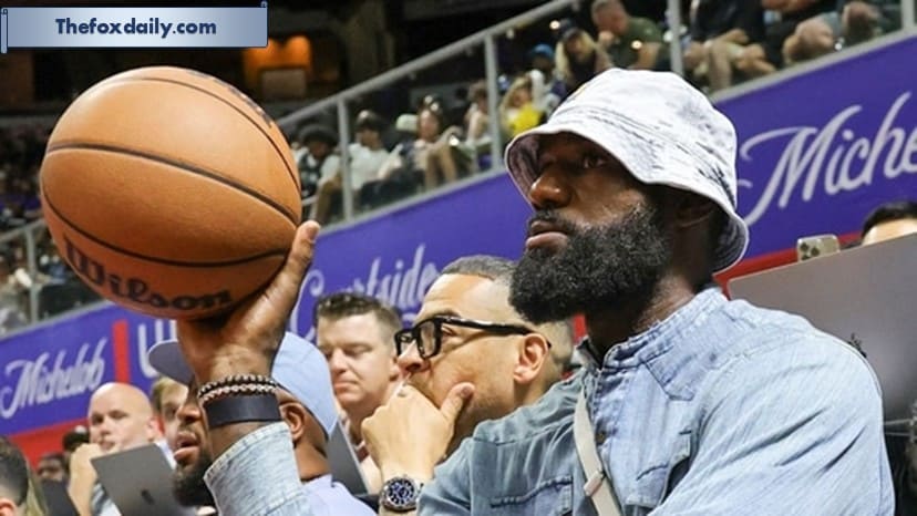 LeBron James throws the ball back to a referee as he attends a 2025 NBA Summer League game between the Lakers and the New Orleans Pelicans