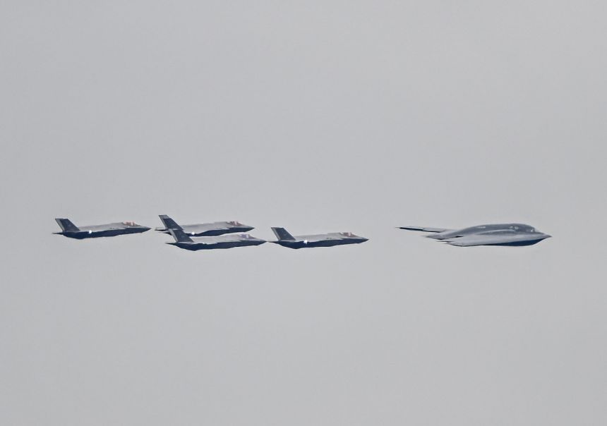 F-35 jets and a B-2 bomber accompany the plane carrying the Russian President Vladimir Putin as he arrives at Elmendorf-Richardson Joint Base ahead of Russian President Vladimir Putin and US President Donald Trump meeting in Alaska, United States on August 15, 2025