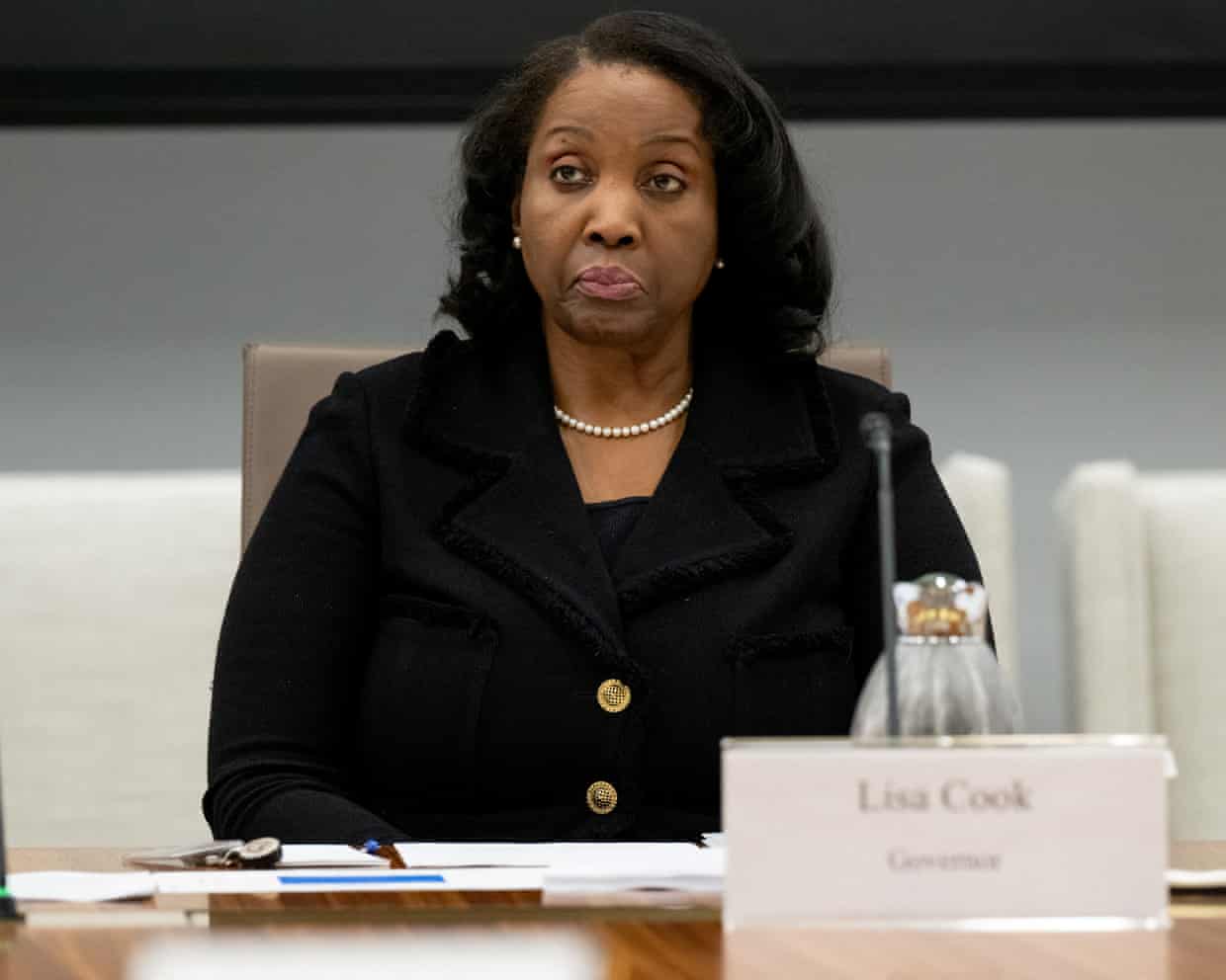Woman sits at table