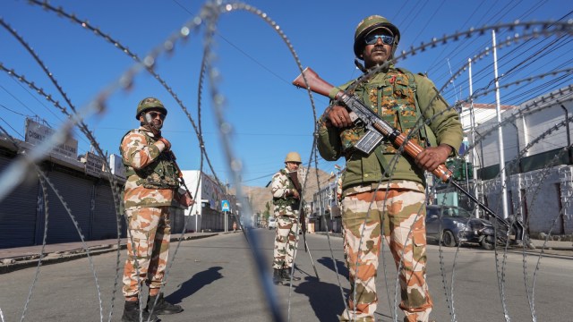 Security personnel stand guard during a curfew in Leh, Ladakh on Friday.