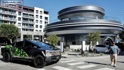 A Tesla Cybertruck drives outside the newly opened Tesla Diner on July 31, 2025, in Hollywood, California