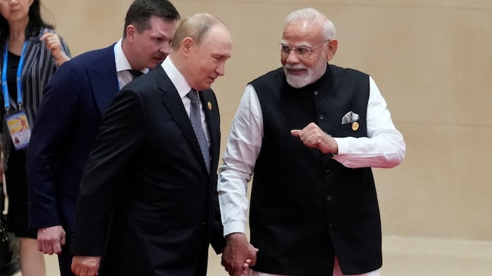 7PM Modi walks with Russian President Vladimir Putin during the Shanghai Cooperation Organization (SCO) summit