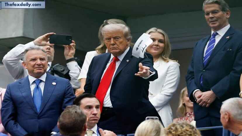 President Donald Trump throws an autographed visor after the final of mens singles at Billie Jean King National Tennis Center
