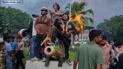 Protesters celebrate at the Singha Durbar, the seat of Nepal's government's various ministries and offices, after it was set on fire Protesters celebrate at the Singha Durbar, the seat of Nepal's government's various ministries and offices, after it was set on fire