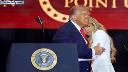 US President Donald Trump embraces Erika Kirk during a memorial service for her husband, slain conservative commentator Charlie Kirk, at State Farm Stadium in Arizona on Sunday