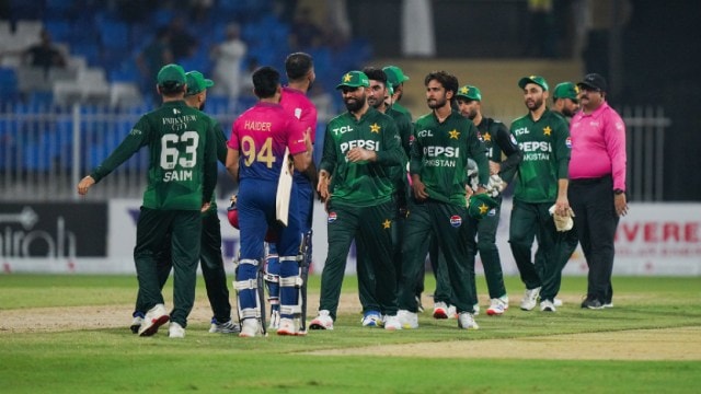 Pakistan players shake hands with UAE players after a T20I match.