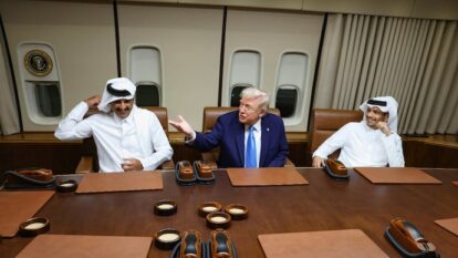 Qatar's Emir Sheikh Tamim bin Hamad Al Thani and Qatar's Foreign Minister react while US President Donald Trump gestures as he speaks during a meeting onboard Air Force One during its refuelling stop at Al Udeid Air Base near Doha. Qatar's Emir Sheikh Tamim bin Hamad Al Thani and Qatar's Foreign Minister react while US President Donald Trump gestures as he speaks during a meeting onboard Air Force One during its refuelling stop at Al Udeid Air Base near Doha.