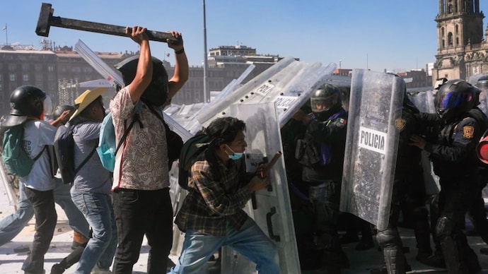 Protesters charge at police during a youth anti-government march in Mexico City, Saturday.