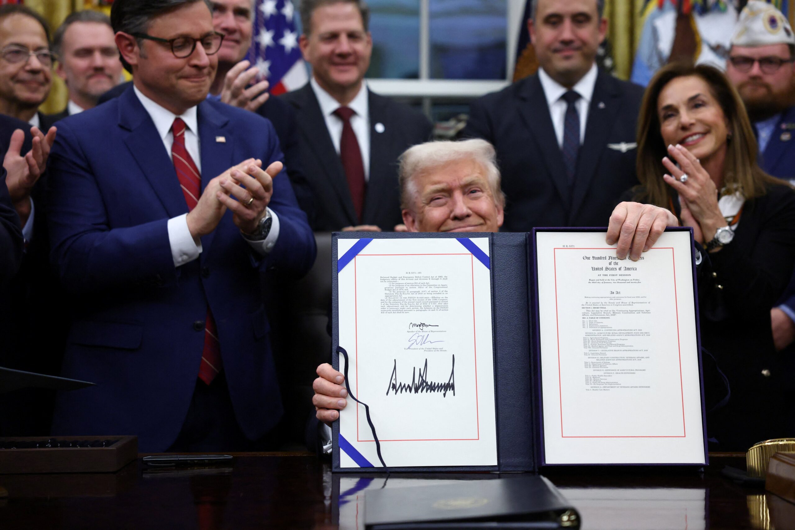 After a record 43 days of disruption, Trump signs a bill to fund the government, ending the shutdown.