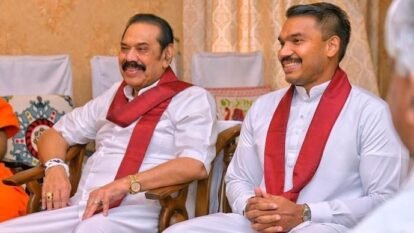 Former Sri Lankan president Mahinda Rajapaksa and his MP son Namal