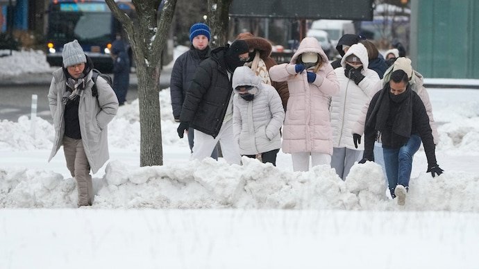 Millions of Americans brace for blizzard conditions as storm threatens East Coast