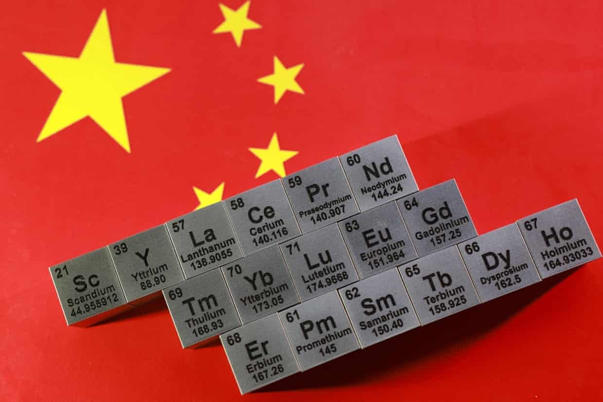Illustration shows blocks with symbols and atomic numbers of Rare Earth Elements and Chinese flag