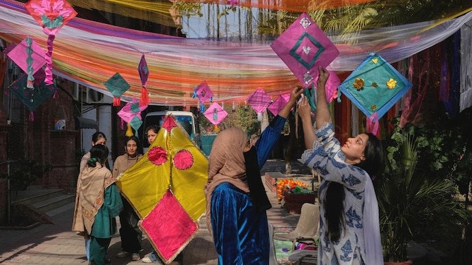 Students of Lahore University decorate their campus with kites for the three-day Basant celebrations.