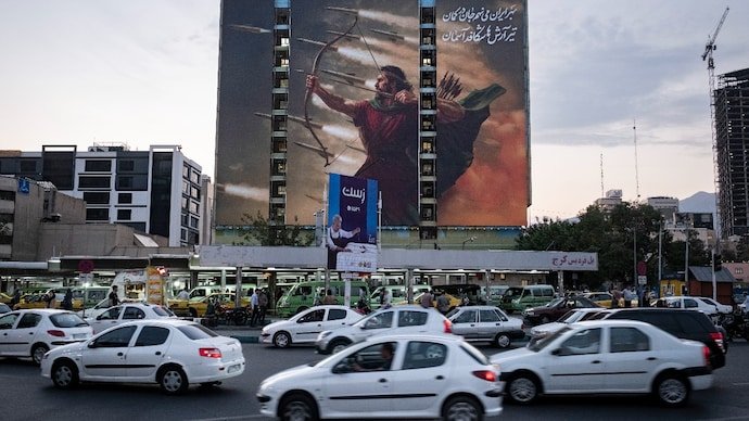 A mural depicting Arash the Archer, a mythical Persian hero who is said to have marked Iran's borders with a single arrow, in Tehran, after the US-Israeli airstrikes in June 2025
