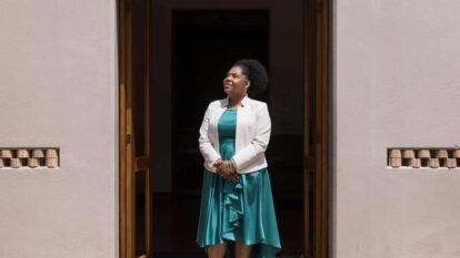Francia Márquez standing in a doorway looking to her right
