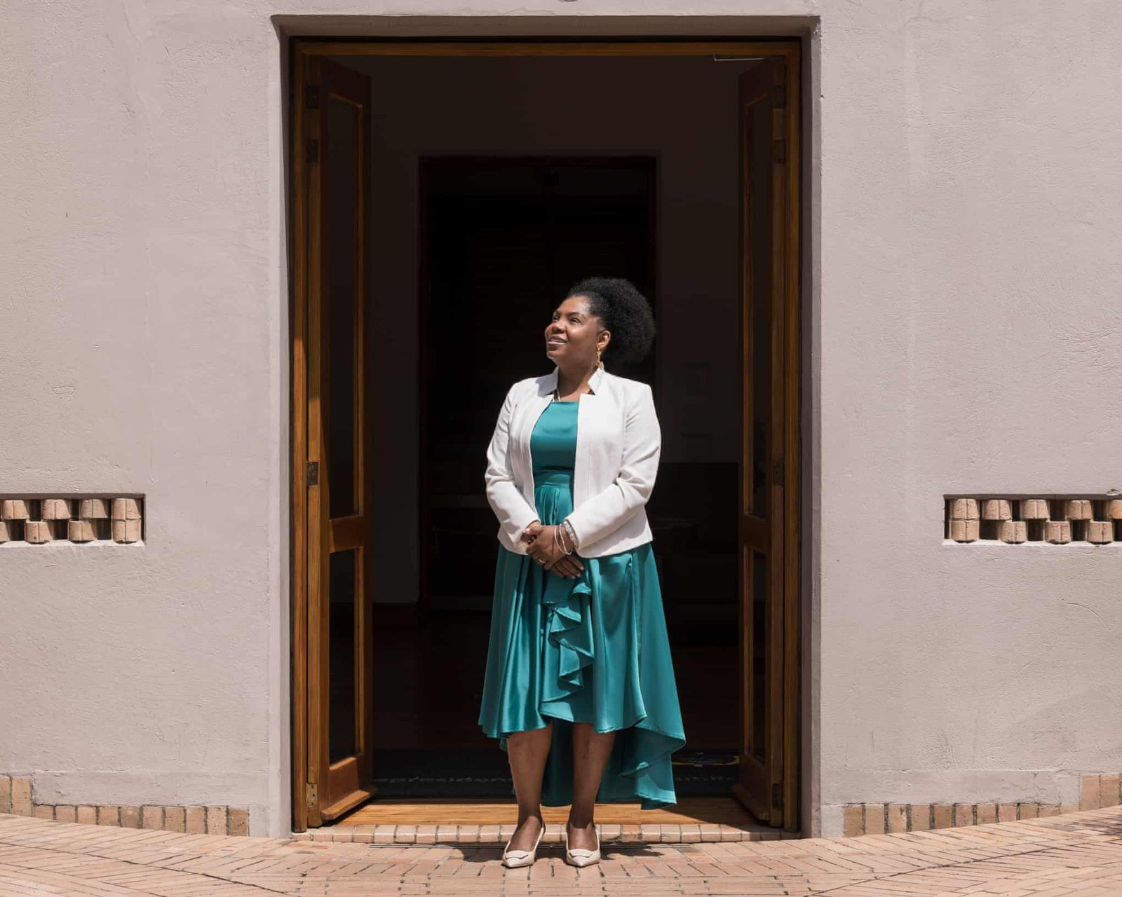Francia Márquez standing in a doorway looking to her right