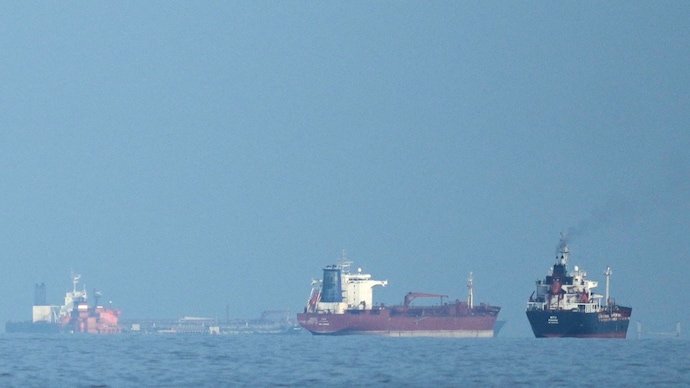 Oil tankers and cargo ships line up in the Strait of Hormuz