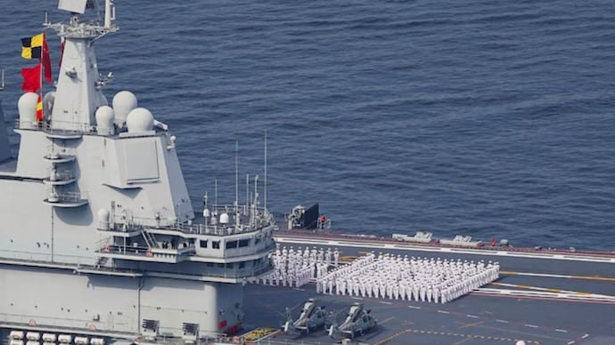 PLA Navy aircraft carrier Shandong sails into Hong Kong.