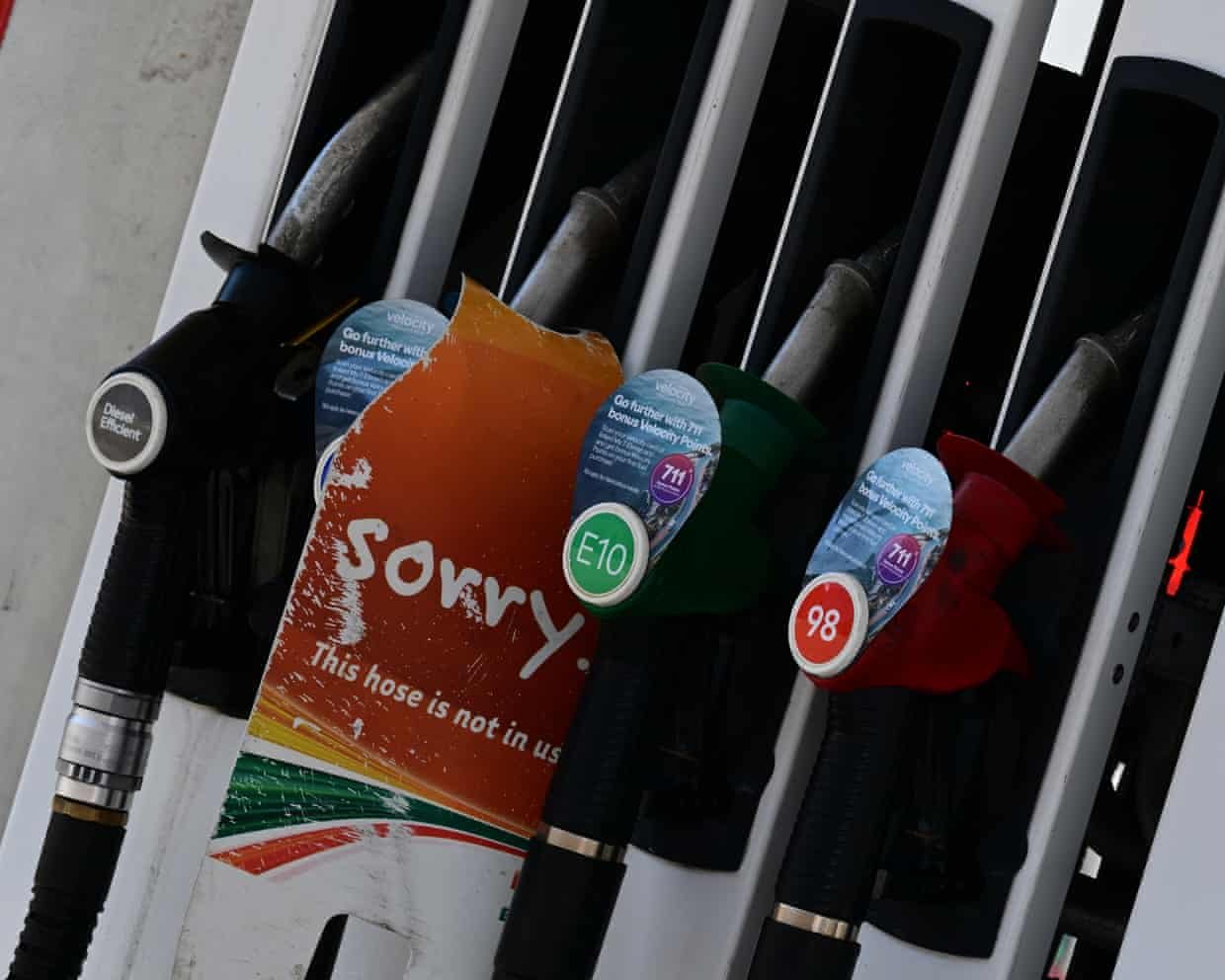 A 7 Eleven Mobile petrol station has signs at the bowser showing sorry they are out of 91 standard unleaded petrol.