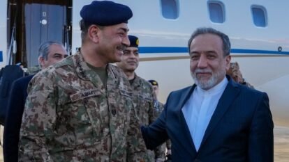 Iranian Foreign Minister Abbas Araqchi welcomes Pakistan army chief Asim Munir at an airport in Tehran.