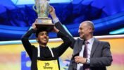 Shrey Parikh lifts the trophy after winning the annual Scripps National Spelling Bee with "cashaw" as his winning word.