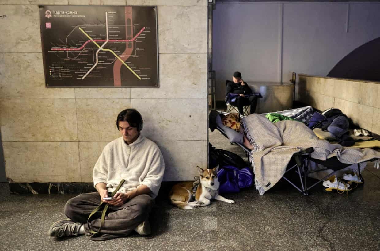 People shelter in a metro station during Russian missile and drone attacks in Kyiv, Ukraine, early on Sunday