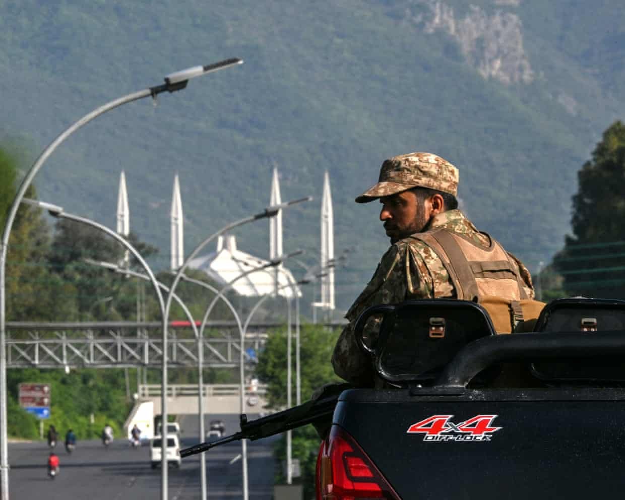An army personnel keeps watch in the Red Zone area of Islamabad