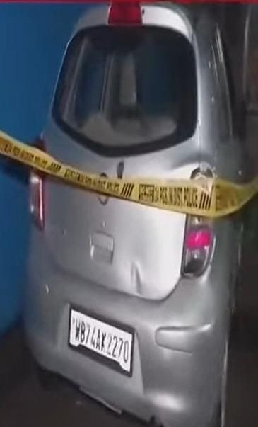 A silver-colour Santro car bearing registration number WB74AX2270 and a motorcycle.