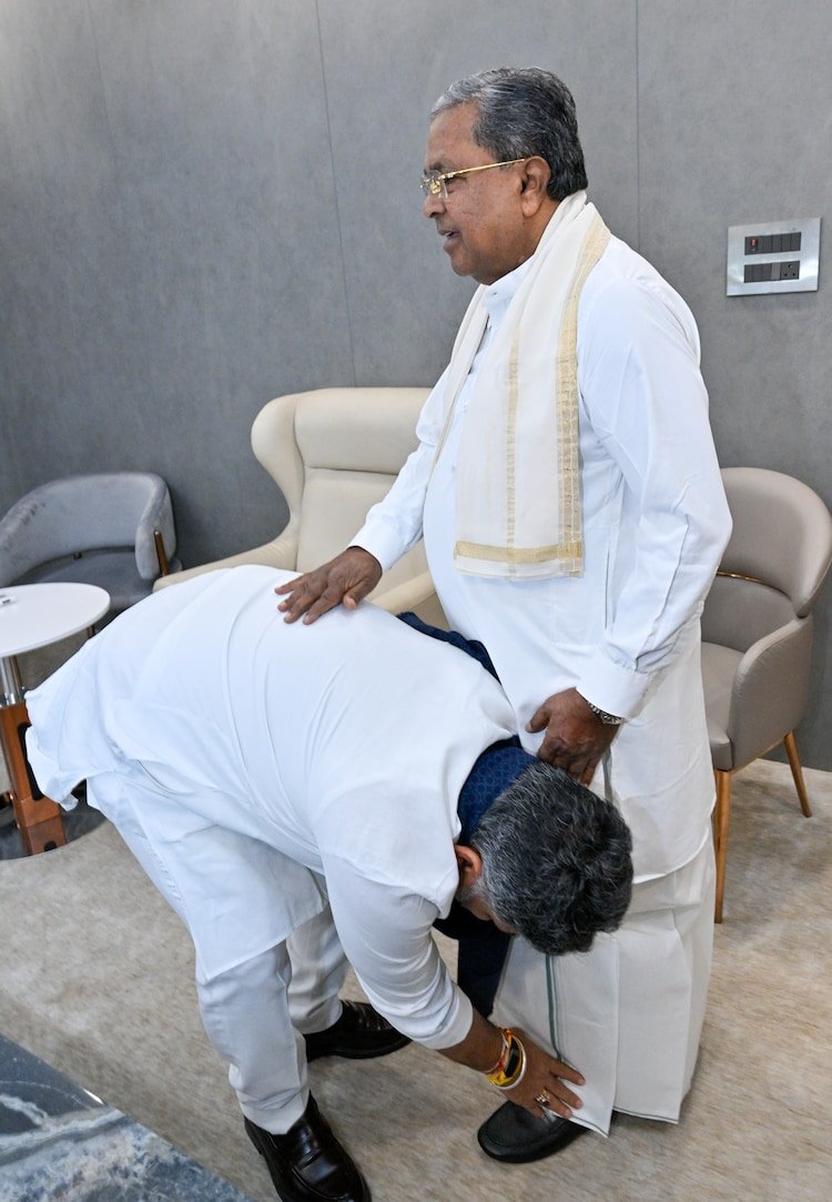 DK Shivakumar hugs Siddaramaiah, touches his feet at breakfast meet