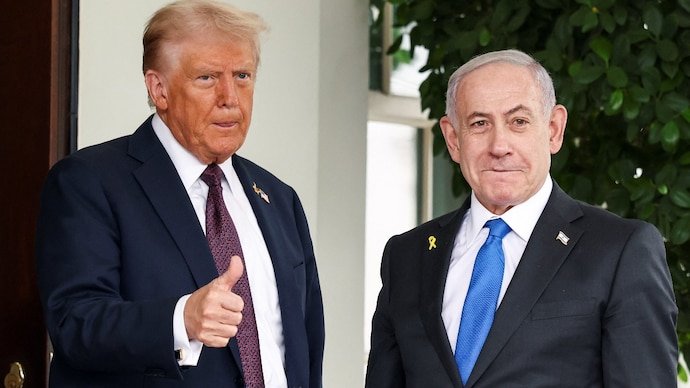 US President Donald Trump gives a thumbs up as he welcomes Israeli Prime Minister Benjamin Netanyahu at the White House in Washington, DC.