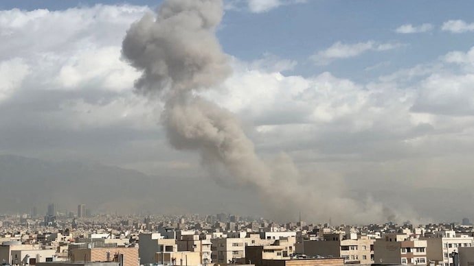 Smoke rises following an explosion in Tehran in February.