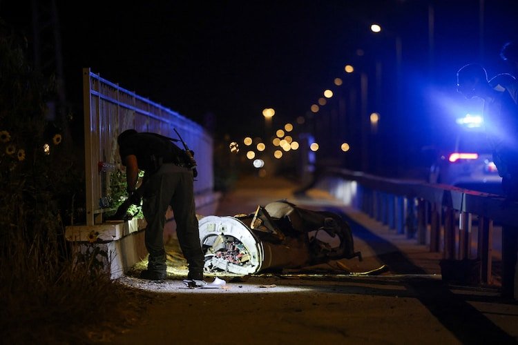 Israeli security works next to a part of a projectile following a missile attack from Iran towards Israel in northern Israel, June 7, 2026. REUTERS