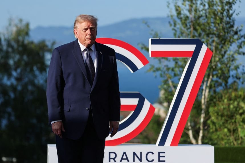 US President Donald Trump arrives for the official greeting during the G7 summit, in Evian, eastern France, on June 15