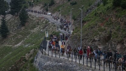 Hindu pilgrims ride horses during their pilgrimage to the cave shrine of Amarnath