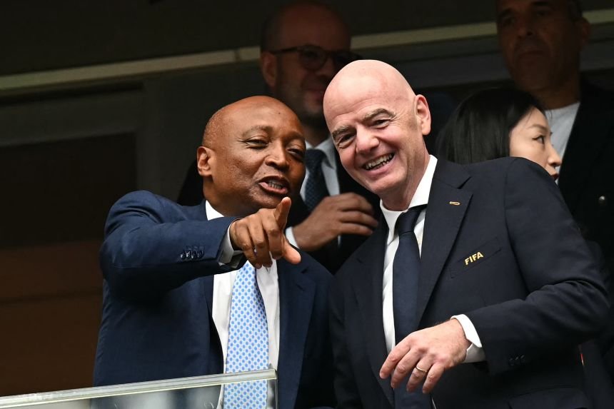 President Patrice Motsepe (L) talks with FIFA President Gianni Infantino ahead of the 2026 World Cup football match between Canada and Morocco at the Houston Stadium in Houston on July 4, 2026.