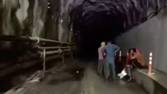 People who were stuck in the tunnel of a hydropower project, in the aftermath of flash floods and a mudslide, as they are rescued, in Rasuwa, Nepal.