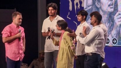 Rahul Gandhi interacts with students on stage during the 'Chhatron Ki Goonj' program, in Prayagraj.