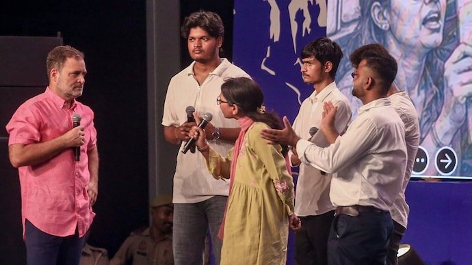 Rahul Gandhi interacts with students on stage during the 'Chhatron Ki Goonj' program, in Prayagraj.